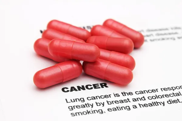 Pills on cancer text — Stock Photo, Image