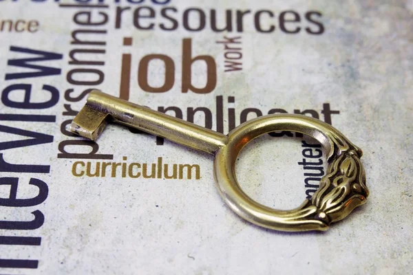 Golden key on job text — Stock Photo, Image