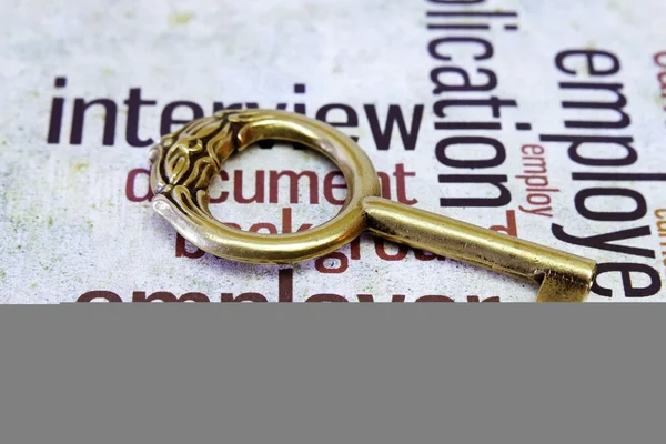 Old key on employer text — Stock Photo, Image