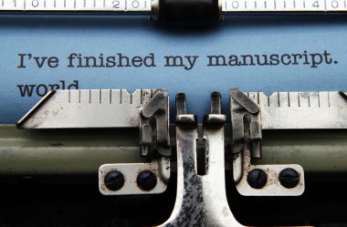Manuscript on typewriter machine clipart