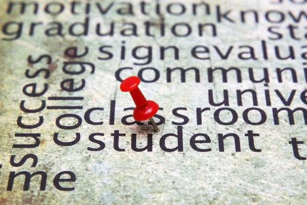 Push pin on student text — Stock Photo, Image