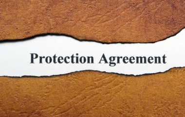 Protection agreement text on torn paper clipart