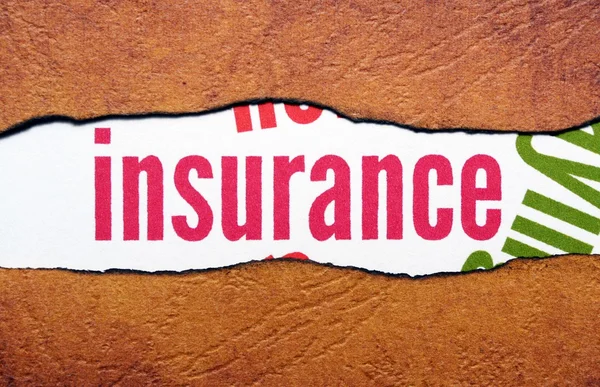 Insurance text on torn paper — Stock Photo, Image