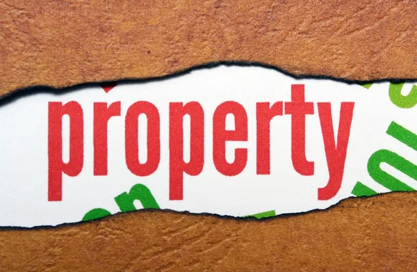 Property text on torn paper — Stock Photo, Image