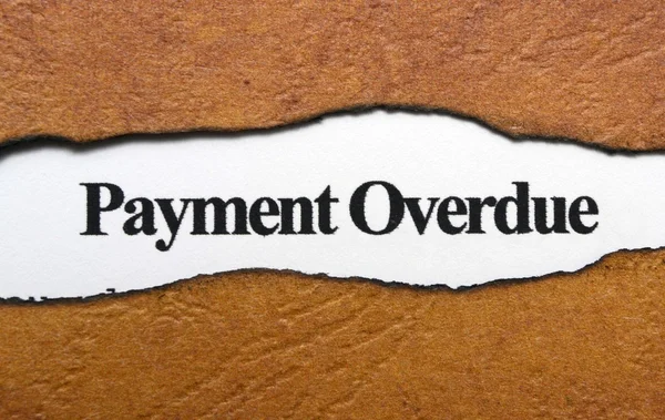 Payment overdue text on torn paper — Stock Photo, Image