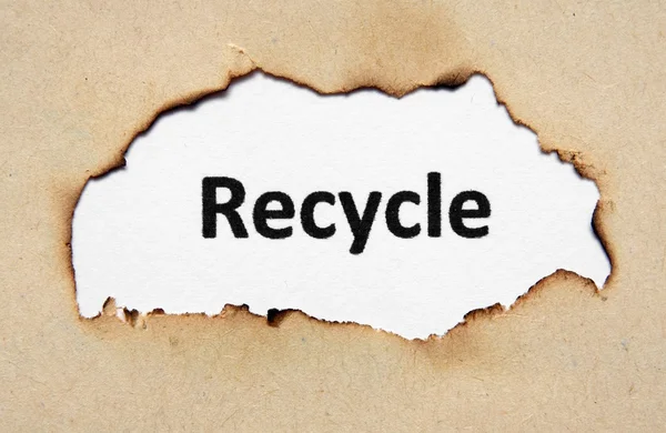 Recycle tekst op papier hole — Stockfoto