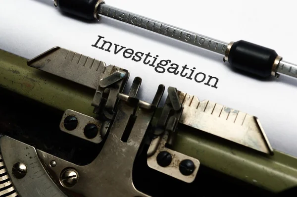 Investigation text on typewriter — Stock Photo, Image