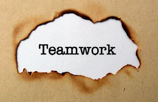 Teamwork text on paper hole — Stock Photo, Image