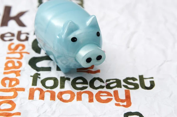 Piggy bank on forecast money concept — Stock Photo, Image