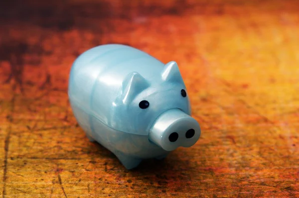 Piggy bank on grunge background — Stock Photo, Image