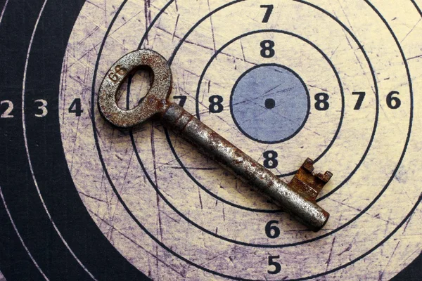 Old key on target — Stock Photo, Image