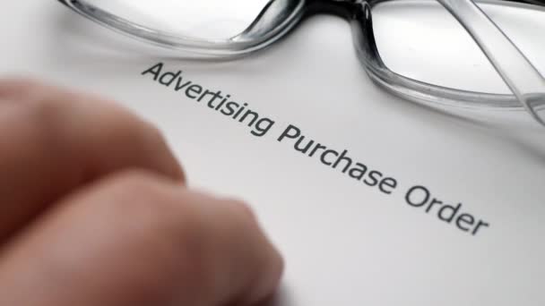 Finger tapping on advertising purchase order — Stock videók