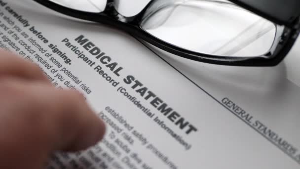 Finger tapping on  medical statement — Stock Video