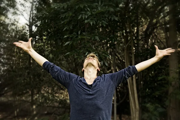 Man Extending Arms in Salutation Yoga Pose — Stock Photo, Image