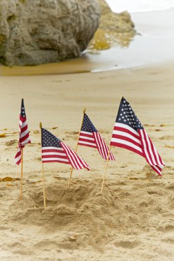 Four American Flags in Sand clipart