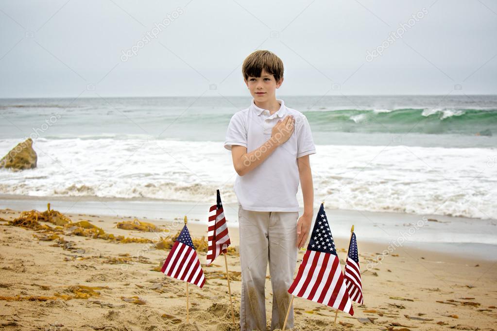 Young Boy Pledges Allegiance to American Flag