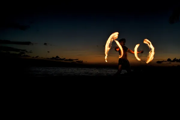 Fire Dancer Creates Circles of Fire Stock Picture