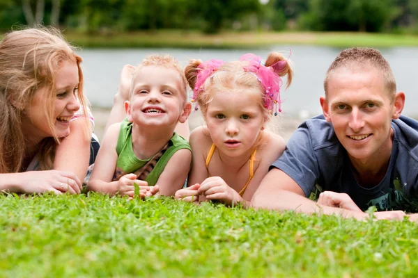 Family on the grass — Stock Photo, Image