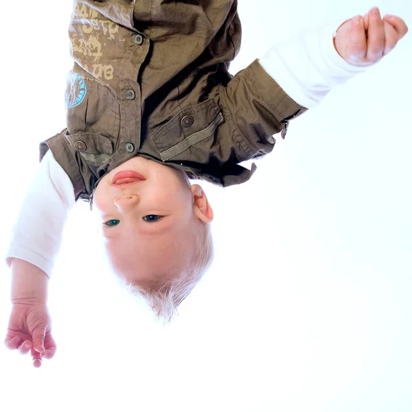 Pretty young baby boy upside down — Stock Photo, Image