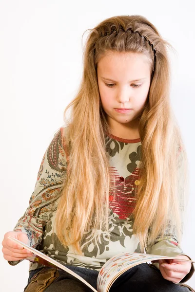 Blond child reading a book — Stock Photo, Image