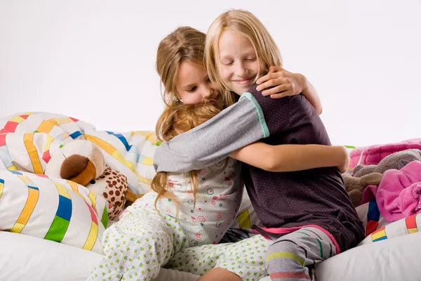 Hugging sisters — Stock Photo, Image