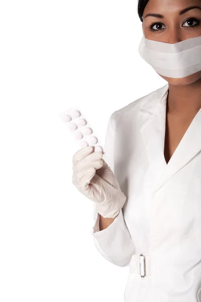 Portrait of a beautifull Indonesian nurse with pills — Stock Photo, Image