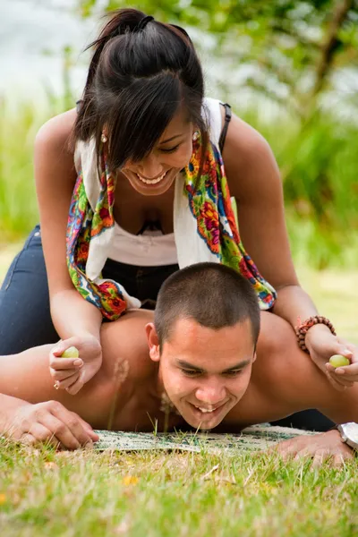 Force feeding with grapes — Stock Photo, Image