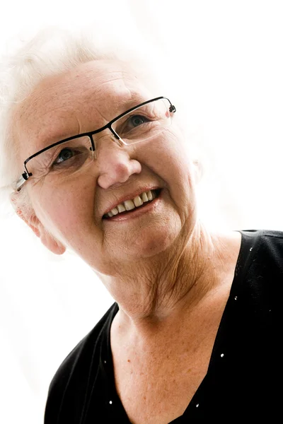 Großmutter im strahlend weißen Licht — Stockfoto