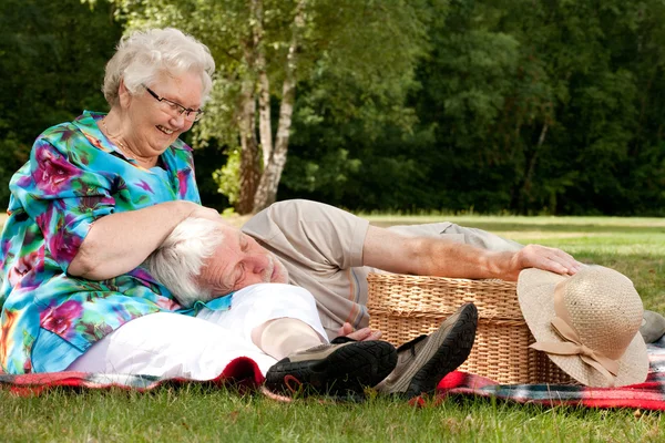 Grandmother is tickling grandfather — Stock Photo, Image