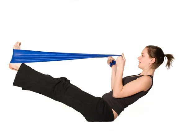 Woman is stretching her legs with a Resistance Band — Stock Photo, Image