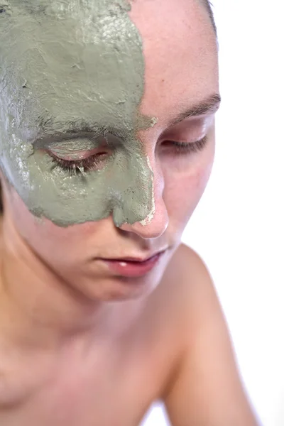 Relaxing with green clay on face — Stock Photo, Image