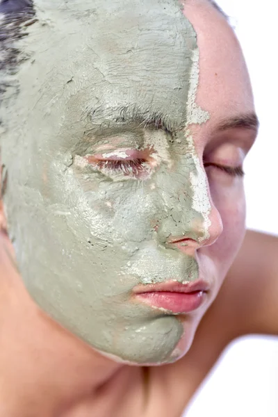 Relaxing with green clay on face — Stock Photo, Image