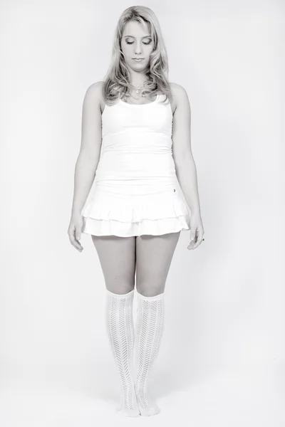 Studio portrait of a long blond girl standing — Stock Photo, Image