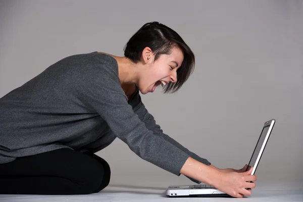 Young woman on floor with notebook — Stock Photo, Image