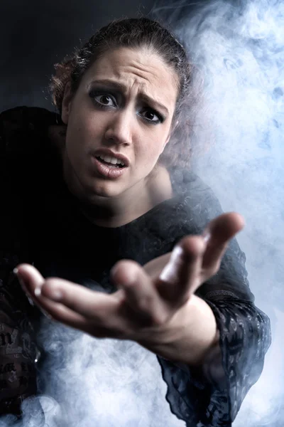 Woman with long curly hair begging — Stock Photo, Image