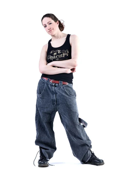 Woman with long curly hair in baggy clothes — Stock Photo, Image