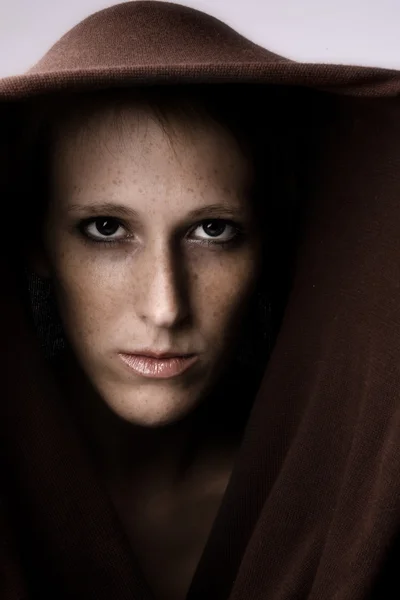 Mean looking and beautifull girl in a turtle neck sweater — Stock Photo, Image