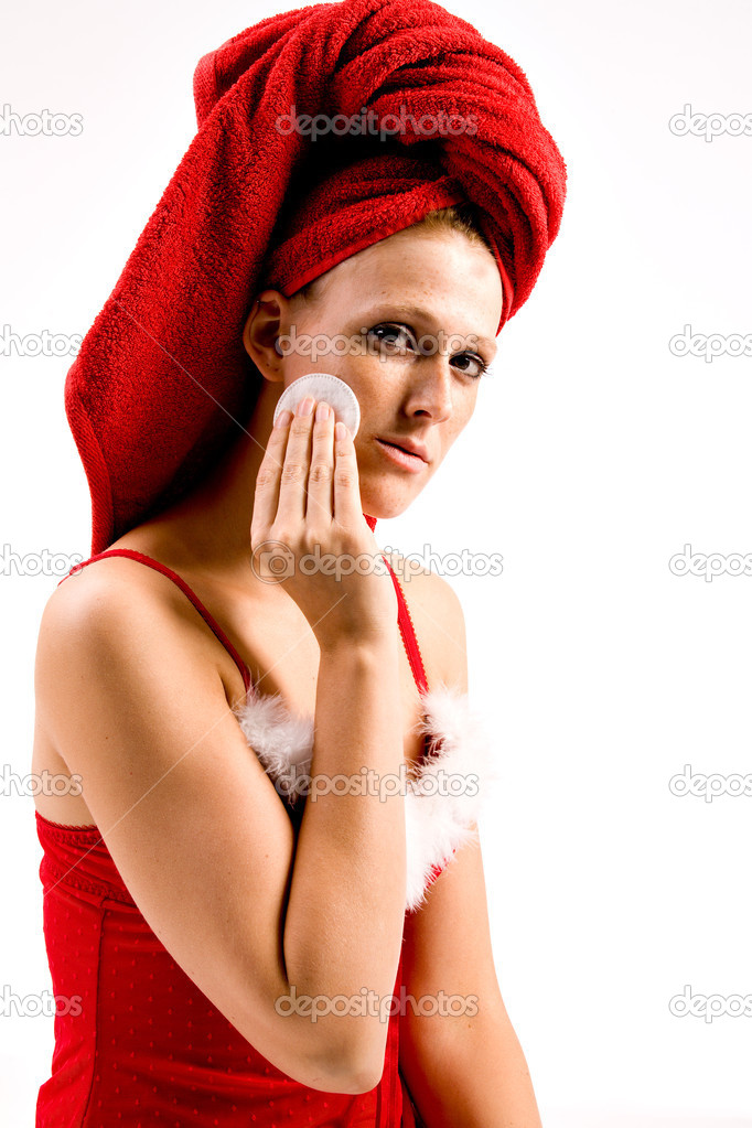 Wellness girl cleaning her face