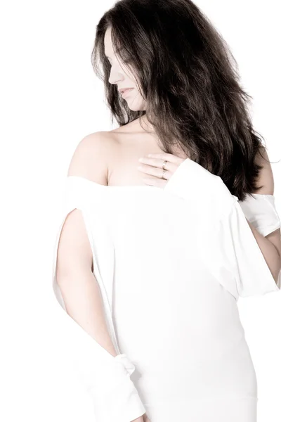 Brunette en chemise blanche sur fond blanc high key looking asi — Photo