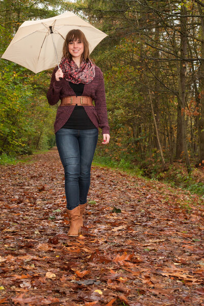 Walking in the park with an umbrella