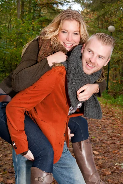 Happy young couple in the autumn — Stock Photo, Image