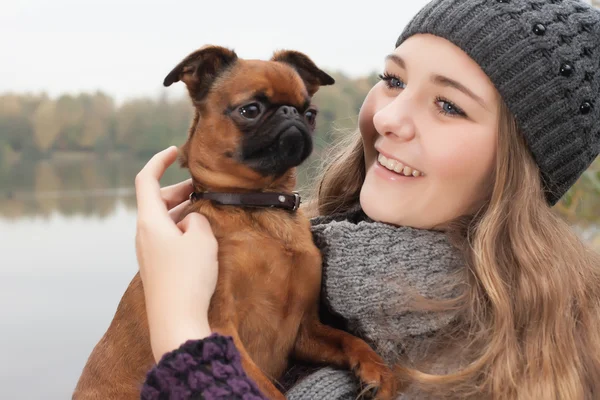 Sweet winter teenager and her dog — Stock Photo, Image