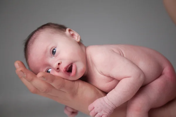 Newborn girl on daddy's arm — Stock Photo, Image