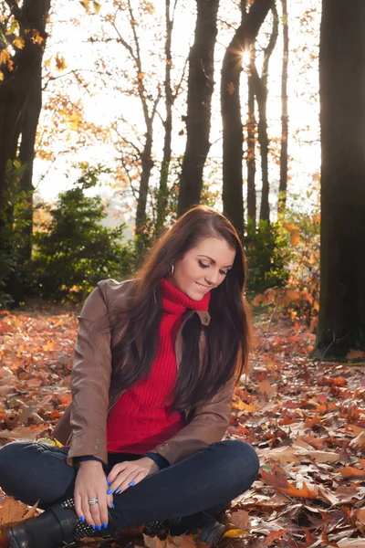 Brunette is looking down — Stock Photo, Image