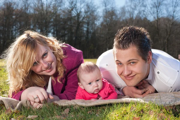 Happy family on a blanket — Stock Photo, Image