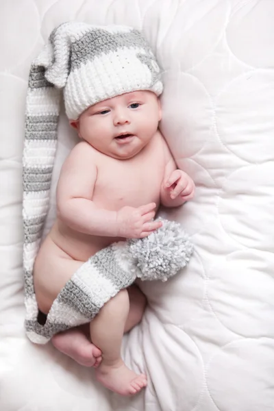 Baby with cap is awake — Stock Photo, Image