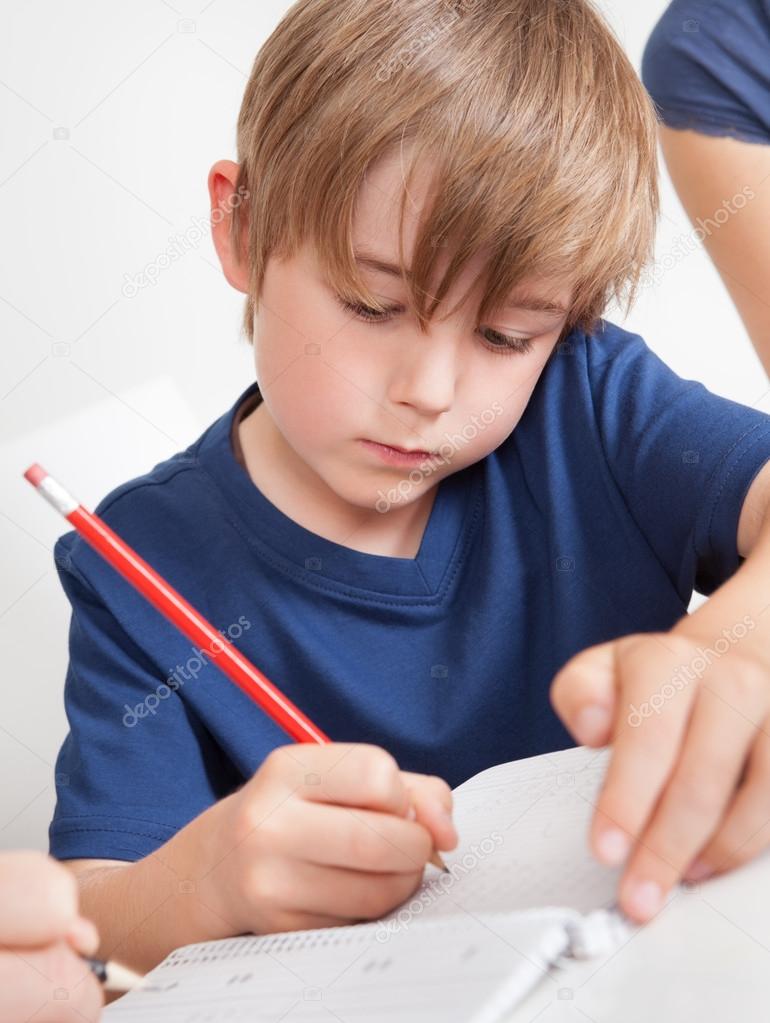 Young boy doing homework