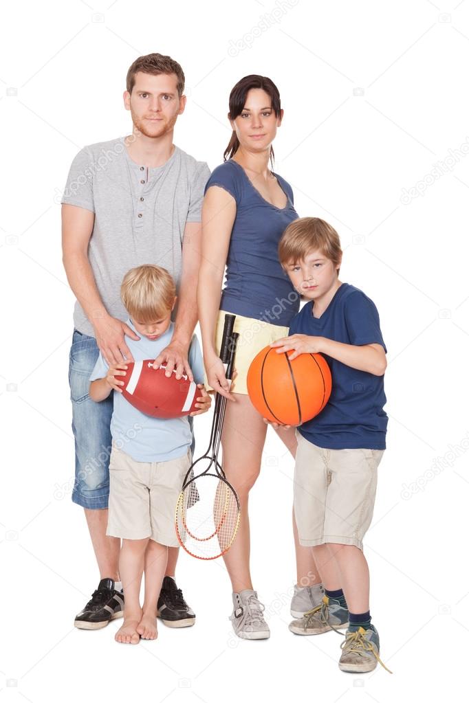 Happy family with children doing sports