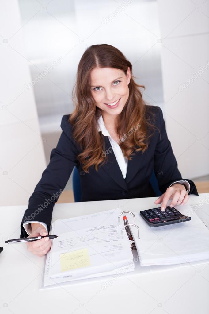Businesswoman using a calculator