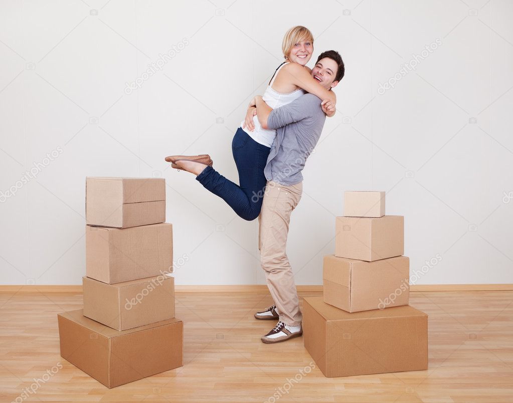 Happy young couple in new home